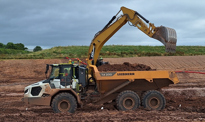 An SER Liebherr TA230 dumptruck being loaded on the Carlisle bypass site