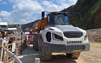 A Liebherr TA230 dump truck with white cab parked in Hillhead quarry for the annual show